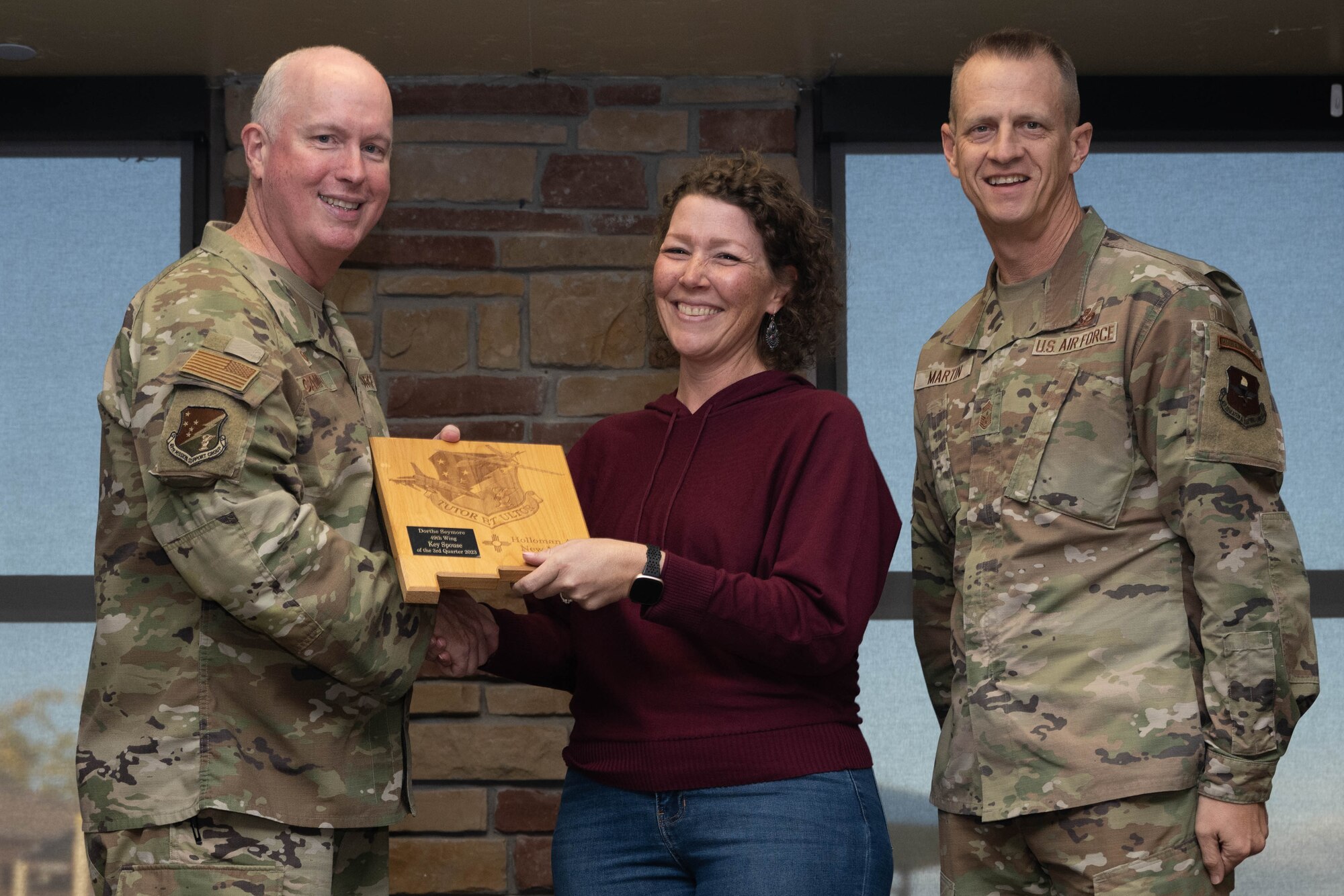 Dorthe Seymore from the 49th Mission Support Group, accepts the Key Spouse of the Quarter Award during the 49th Wing’s 3rd Quarter Award ceremony at Holloman Air Force Base, New Mexico, November 9, 2023. Quarterly award winners were selected based on their technical expertise, demonstration of leadership and job performance. (U.S. Air Force photo by Airman 1st Class Bob Teichmann)