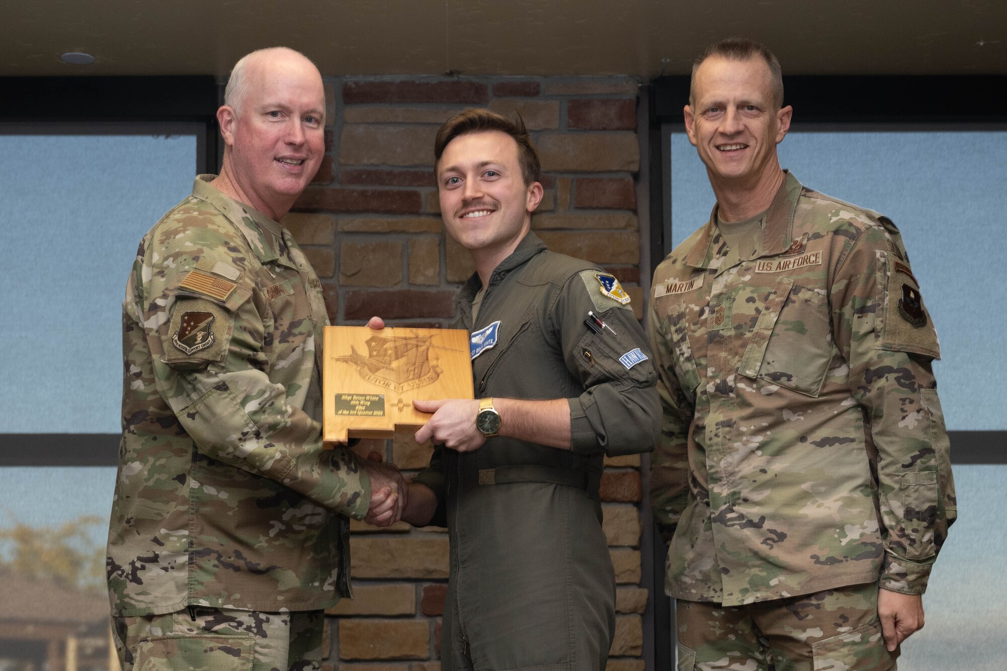 U.S. Air Force Staff Sgt. Brian White from the 49th Operations Group accepts the 3rd Quarter 49er Award during the 49th Wing’s 3rd Quarter Award ceremony at Holloman Air Force Base, New Mexico, November 9, 2023. Quarterly award winners were selected based on their technical expertise, demonstration of leadership and job performance. (U.S. Air Force photo by Airman 1st Class Bob Teichmann)