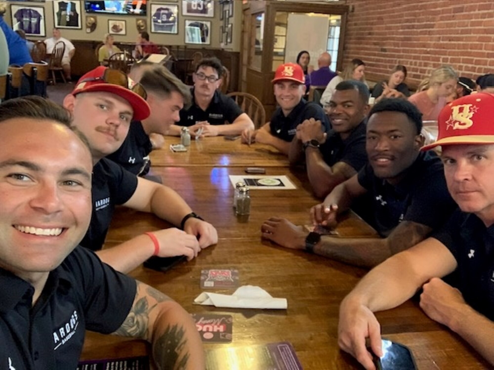 U.S. Air Force Tech Sgt. Travis J. Hackett, 1st Special Operations Security Forces Squadron standardization and evaluation, takes a selfie with his WarDogs Baseball teammates. The WarDogs annually choose the best baseball players from the United States Armed Forces. (Courtesy photo)