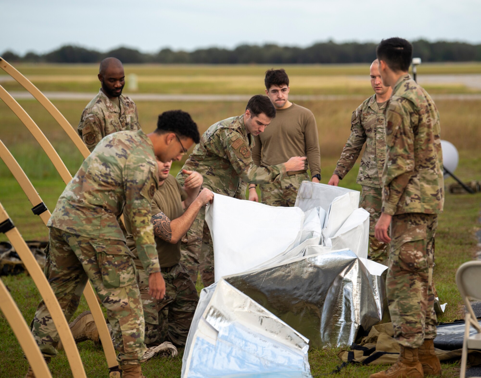 Mosaic Tiger 24-1 participants build a command and control tent at Avon Park Air Force Range, Florida, Nov. 13, 2023. In a contested environment with degraded communication, mission command is essential via clear communication of intent, understanding and trust. (U.S. Air Force photo by Airman 1st Class Leonid Soubbotine)