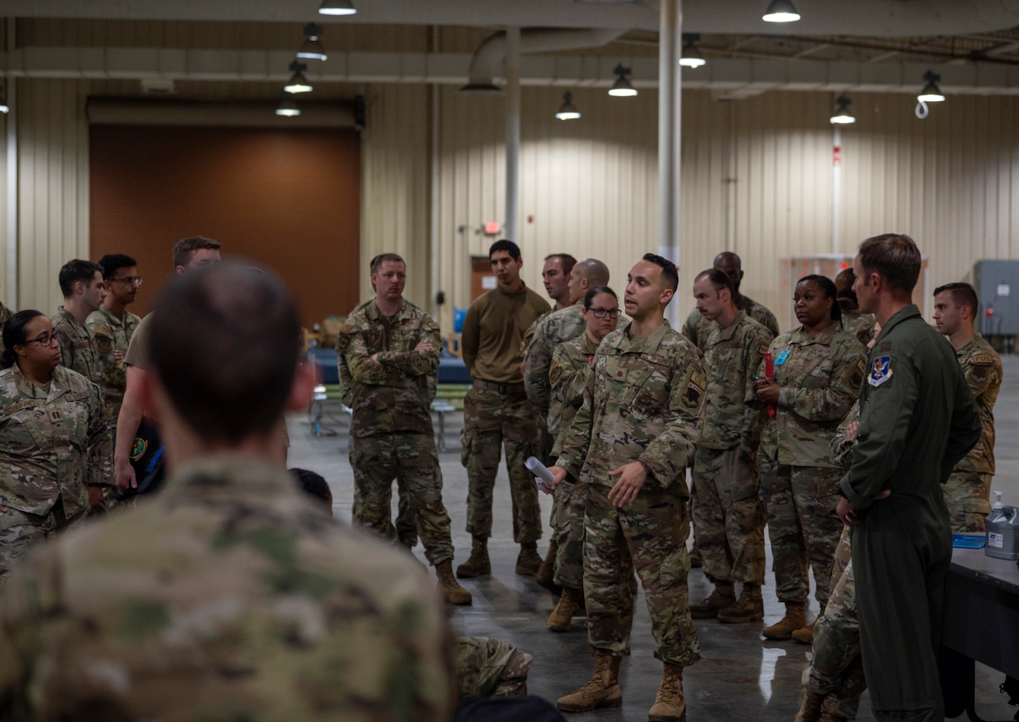 U.S. Air Force Maj. Chris Valencia, Air Base Squadron commander, briefs Mosaic Tiger 24-1 exercise participants at Avon Park Air Force Range, Florida, Nov. 13, 2023. Mosaic Tiger exercise strengthens the ability to deploy at a moment’s notice and project airpower from dispersed locations. (U.S. Air Force photo by Airman 1st Class Leonid Soubbotine)