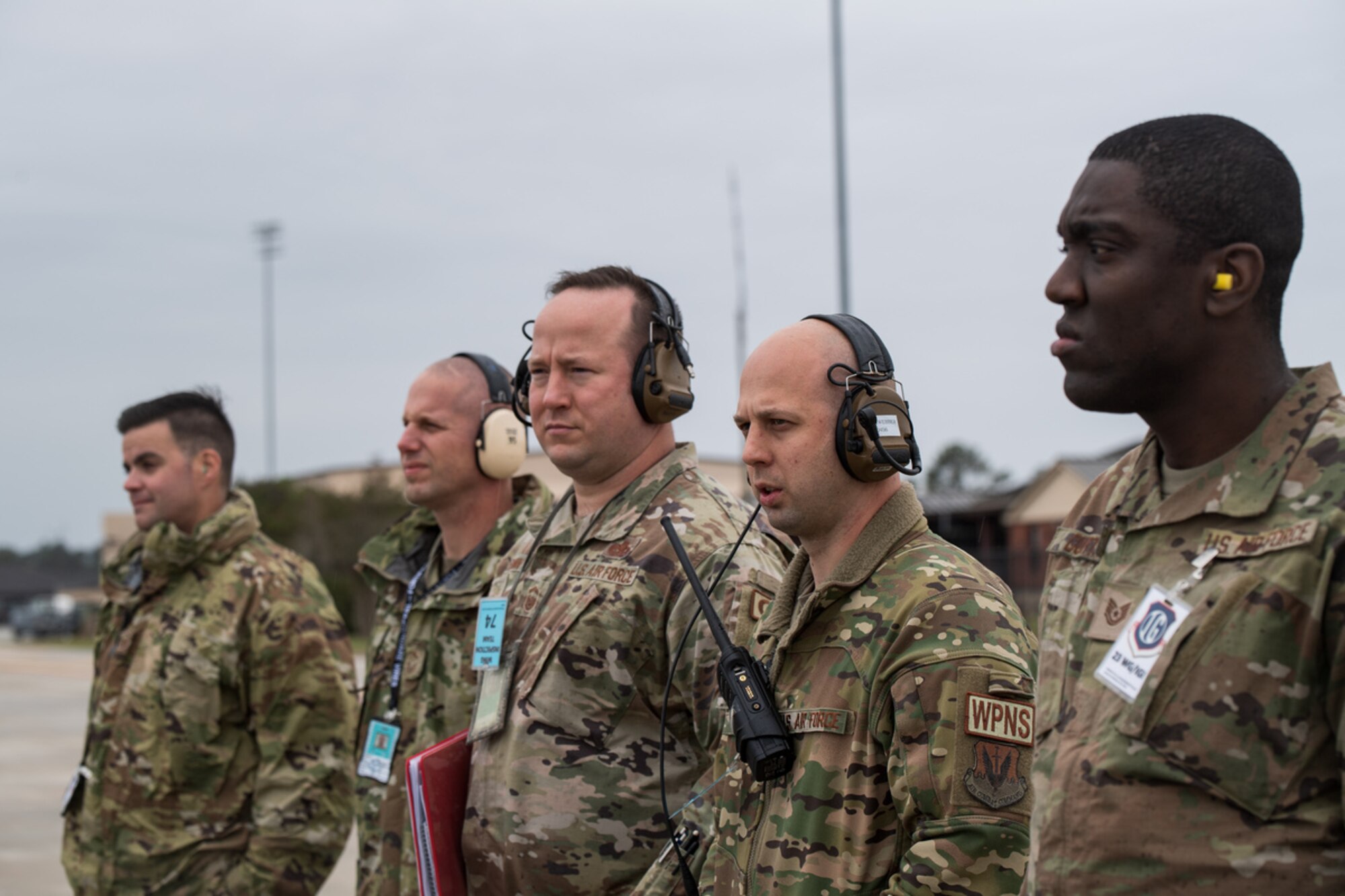Evaluators and observers from the 23rd Wing and various units throughout Air Combat Command wait on the flightline for an exercise inject during exercise Mosaic Tiger 24-1 at Moody Air Force Base, Georgia, Nov. 14, 2023. The ACC/IG team are evaluating the 23rd Wing’s wing inspection team to validate the effectiveness of the wing’s evaluators – a practice to standardize expectations for wing operations across the command. (U.S. Air Force photo by Andrea Jenkins)