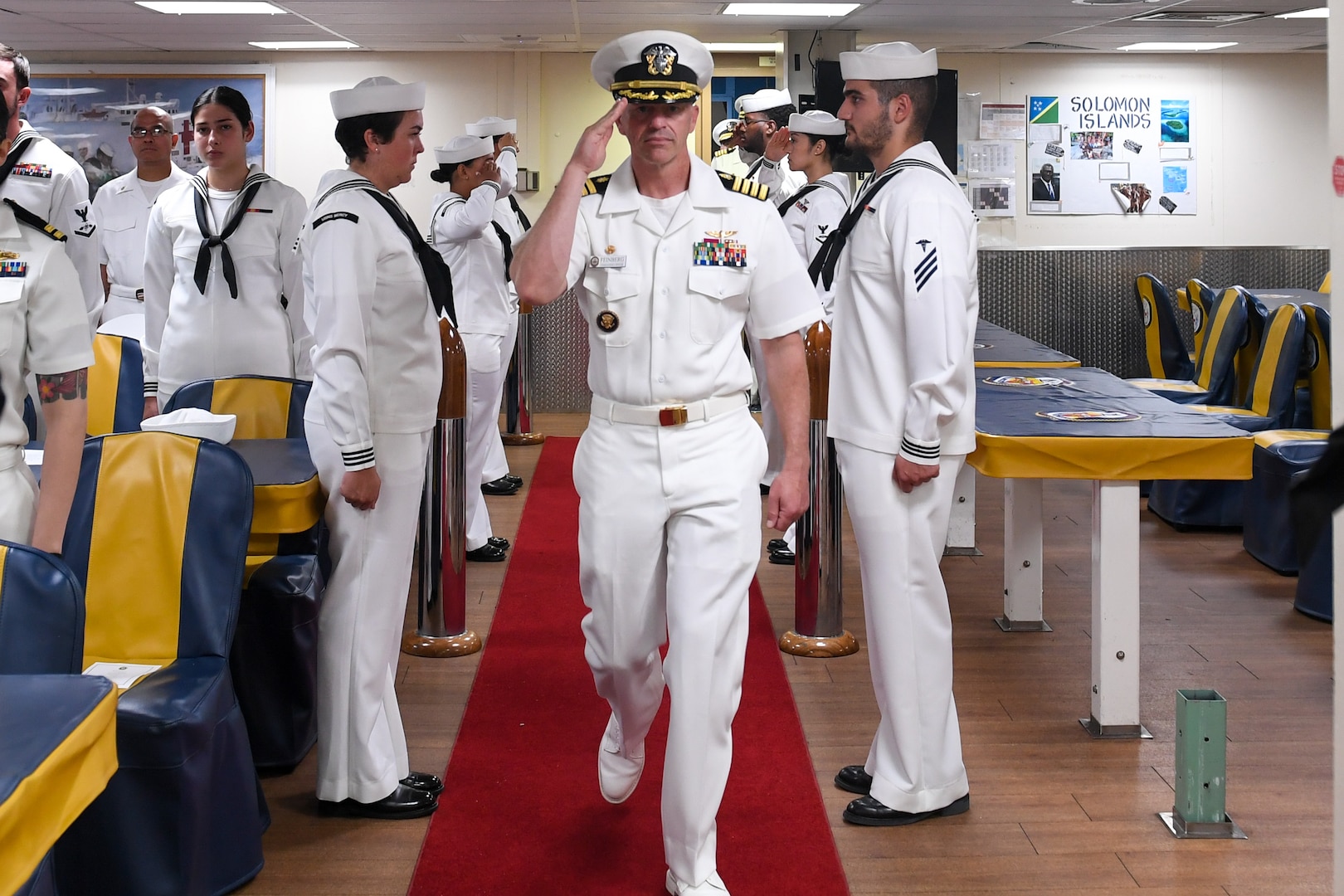 U.S. Navy Capt. Jeffrey Feinberg, commanding officer of the hospital ship USNS Mercy (T-AH 19), is piped aboard Mercy during the Pacific Partnership 2024-1 closing ceremony for the Republic of the Marshall Islands mission stop Nov. 10, 2023. Pacific Partnership, now in its 19th iteration, is the largest multinational humanitarian assistance and disaster relief preparedness mission conducted in the Indo-Pacific and works to enhance regional interoperability and disaster response capabilities, increase security stability in the region, and foster new and enduring friendships. (U.S. Navy photo by Mass Communication Specialist Seaman Justin Ontiveros