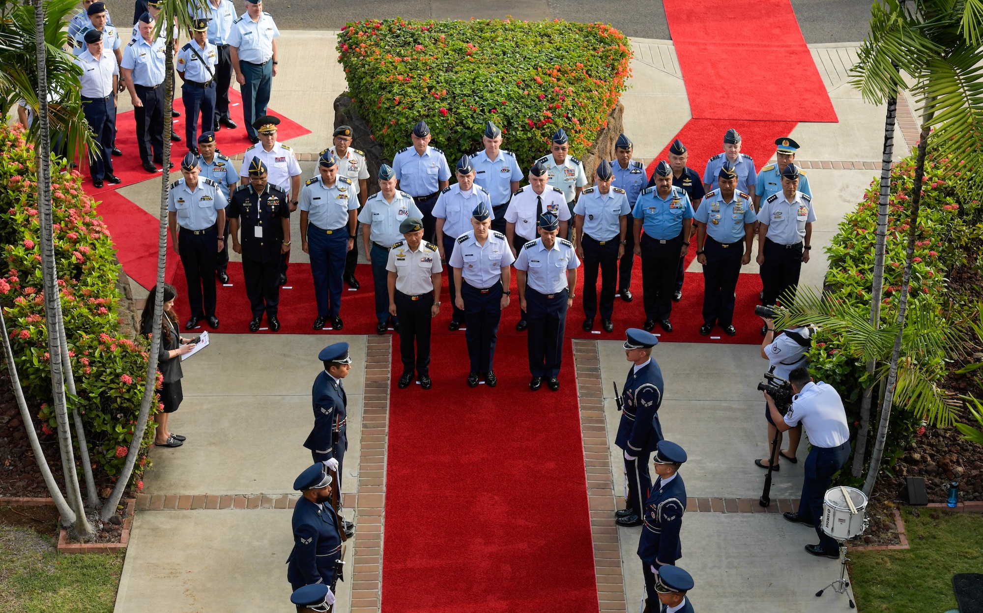 Air chiefs and senior enlisted leaders from more than 20 countries stand in formation during the opening ceremony of the Pacific Air Chiefs Symposium 2023 at Joint Base Pearl Harbor-Hickam, Hawaii, Nov. 14, 2023. The vision of a free and open Indo-Pacific is shared across the globe – and is achievable together. (U.S. Air Force photo by Airman 1st Class Caroline Strickland)