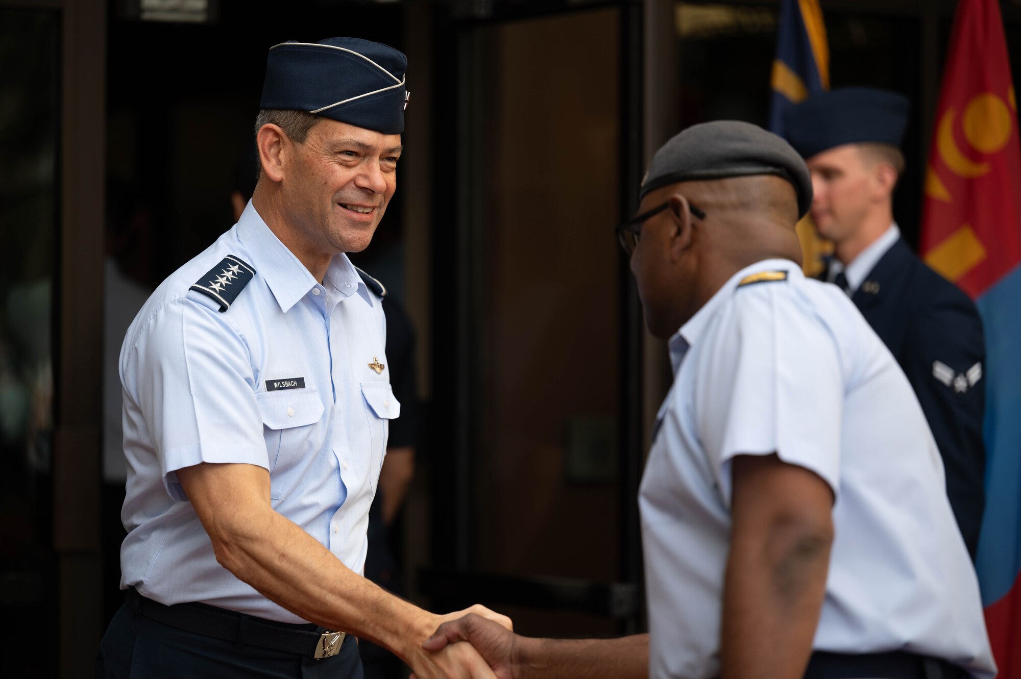 Gen. Ken Wilsbach, Pacific Air Forces commander, greets senior enlisted leaders during the opening ceremony of the Pacific Air Chiefs Symposium 2023 at Joint Base Pearl Harbor-Hickam, Hawaii, Nov. 14, 2023. The week-long event focuses on applying global lessons to challenges of regional security and is the largest biannual air chief symposium to date, with more than 20 countries attending. (U.S. Air Force photo by Staff Sgt. Alan Ricker)