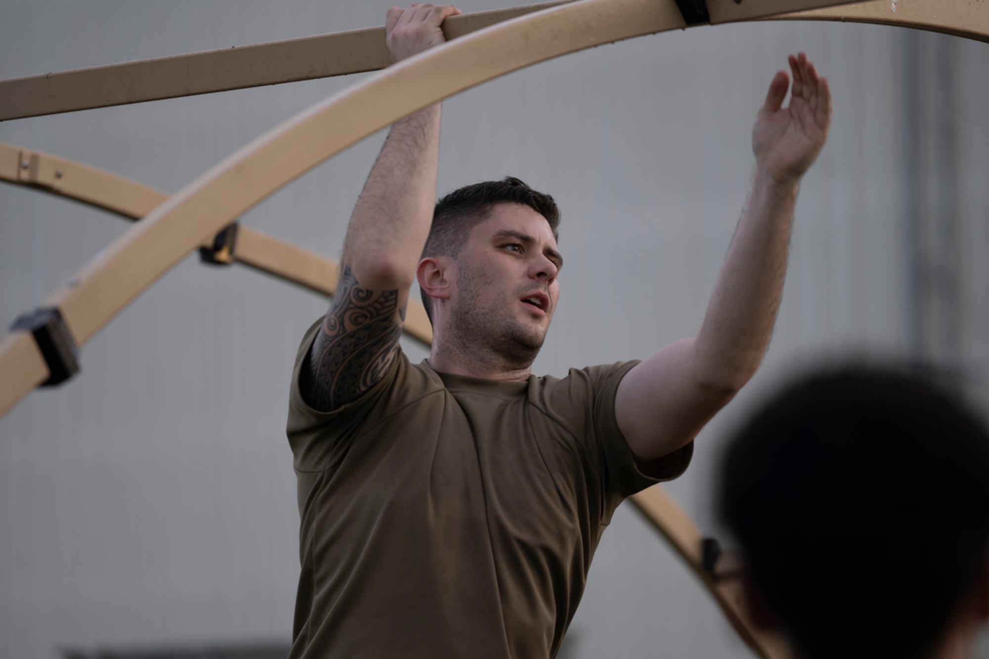 A U.S. Air Force Airman assigned to the 23rd Wing helps build a tent during exercise Mosaic Tiger 24-1 at Avon Park Air Force Range, Florida, Nov. 13, 2023. The tent served as a rapidly constructed location to run command and control capabilities. (U.S. Air Force photo by Senior Airman Rachel Coates)