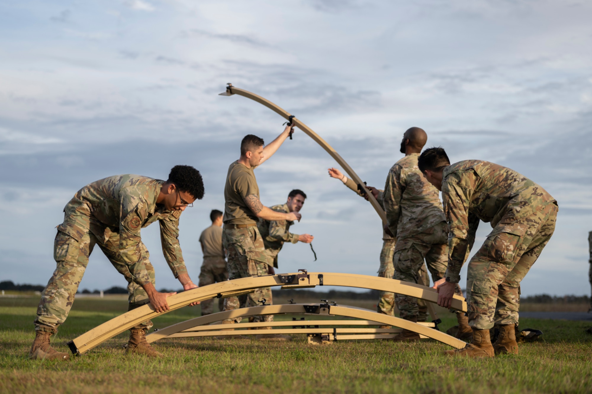 U.S. Air Force Airmen build a tent during exercise Mosaic Tiger 24-1 at Avon Park Air Force Range, Florida, Nov. 13, 2023. The tent served as a rapidly built location to run command and control capabilities. (U.S. Air Force photo by Senior Airman Rachel Coates)