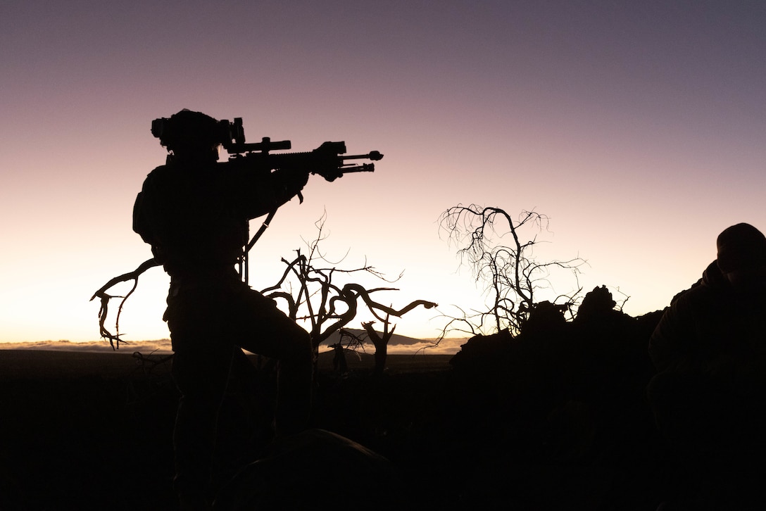 U.S. Marine Corps Sgt. Khongor Gereltuya observes his sectors of fire during the Joint Pacific Multinational Readiness Center exercise at Pohakuloa Training Area, Nov. 4, 2023. The Joint Pacific Multinational Readiness Center is the U.S. Army’s newest Combat Training Center, designed to generate readiness in the environments and conditions our forces are most likely to operate in. JPMRC 24-01 includes over 5,300 training participants, to include members from across the U.S. Joint Force, New Zealand, the United Kingdom, Indonesia, and Thailand. From Nov. 1-10, U.S. Marines with 3d Littoral Combat Team, 3d Marine Littoral Regiment, 3d Marine Division, will be conducting training alongside Soldiers with 25th Infantry Division at Pohakuloa Training Area during JPMRC. Gereltuya is a rifleman with 3d LCT, 3d MLR, 3d Marine Division and is a native of Chicago, Illinois.