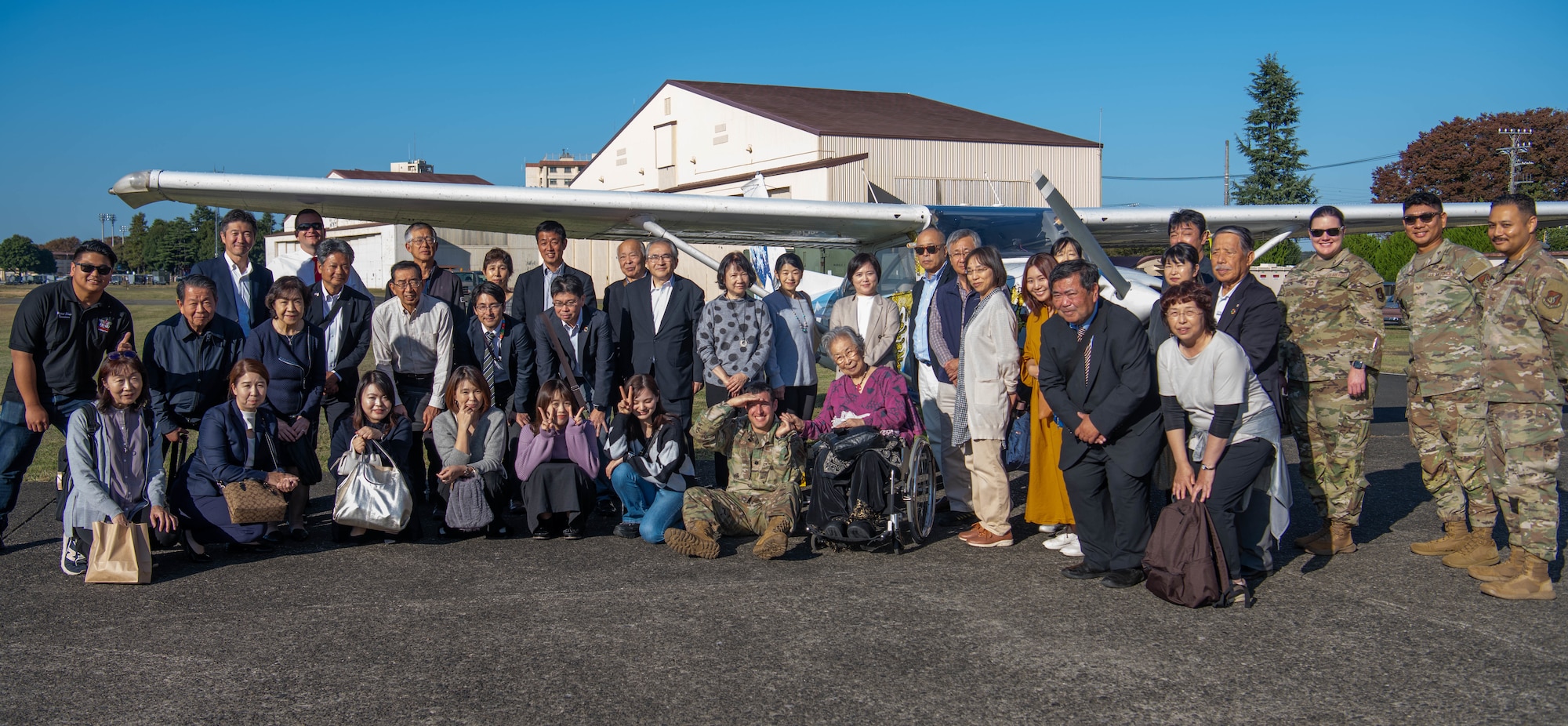 Members of the Akishima-Yokota Friendship Club and the 374th Mission Support Group pose for a photo.