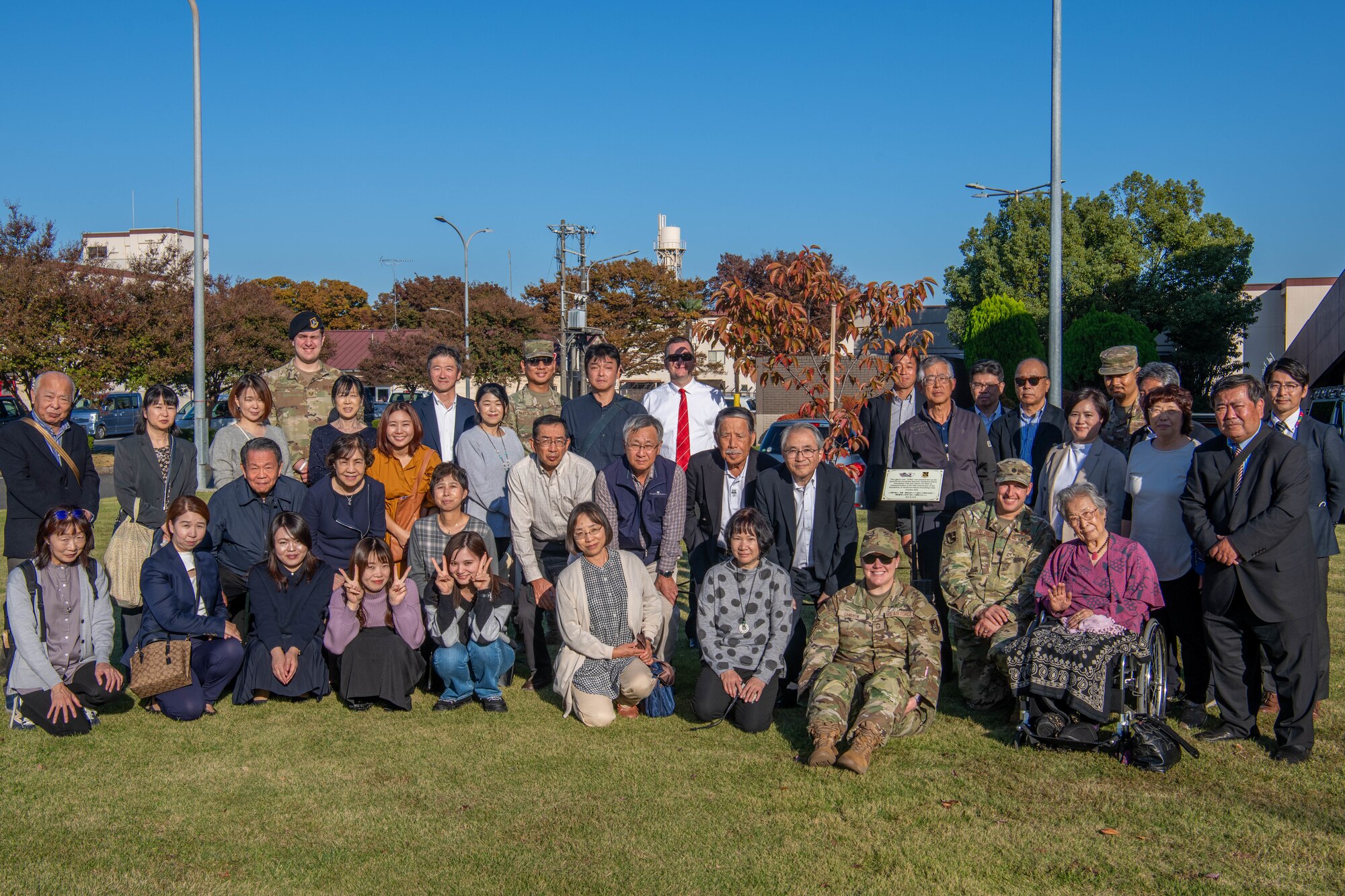 Members of the Akishima-Yokota Friendship Club and members of the 374th Mission Support Group pose for a photo.