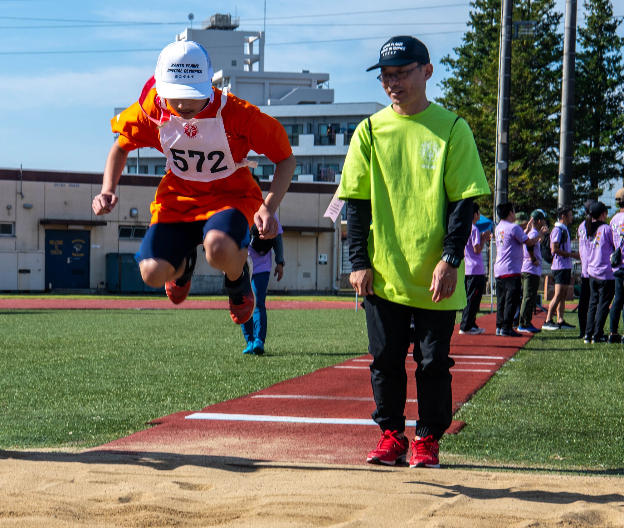 An athlete competes in the standing long-jump competition.
