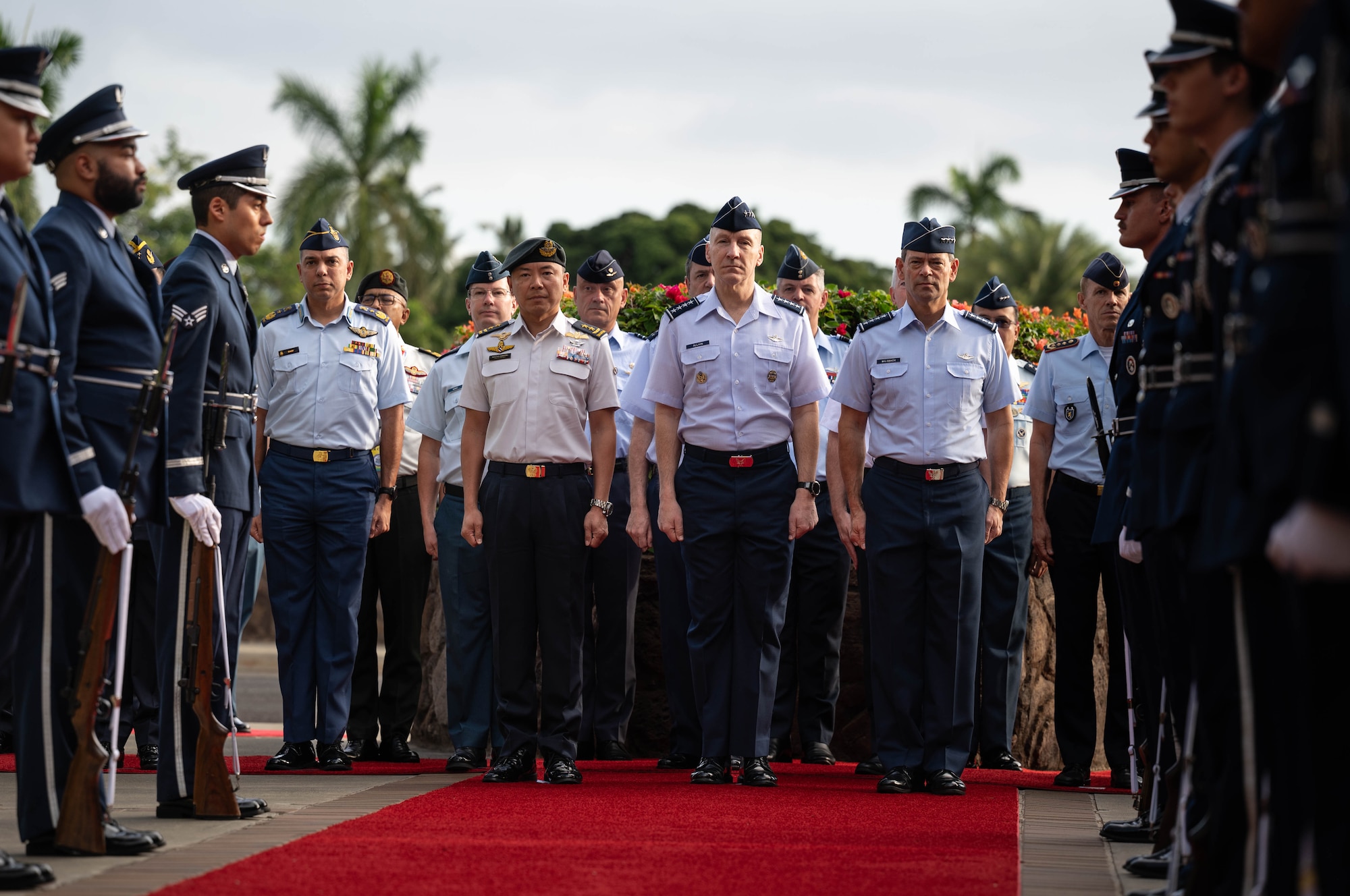 Air chiefs and senior enlisted leaders from more than 20 countries stand in formation during the opening ceremony of the Pacific Air Chiefs Symposium 2023 at Joint Base Pearl Harbor-Hickam, Hawaii, Nov. 14, 2023. The symposium provided an opportunity for senior leaders from around the globe to share regional perspectives through bilateral and multilateral engagements and panels. (U.S. Air Force photo by Staff Sgt. Alan Ricker)