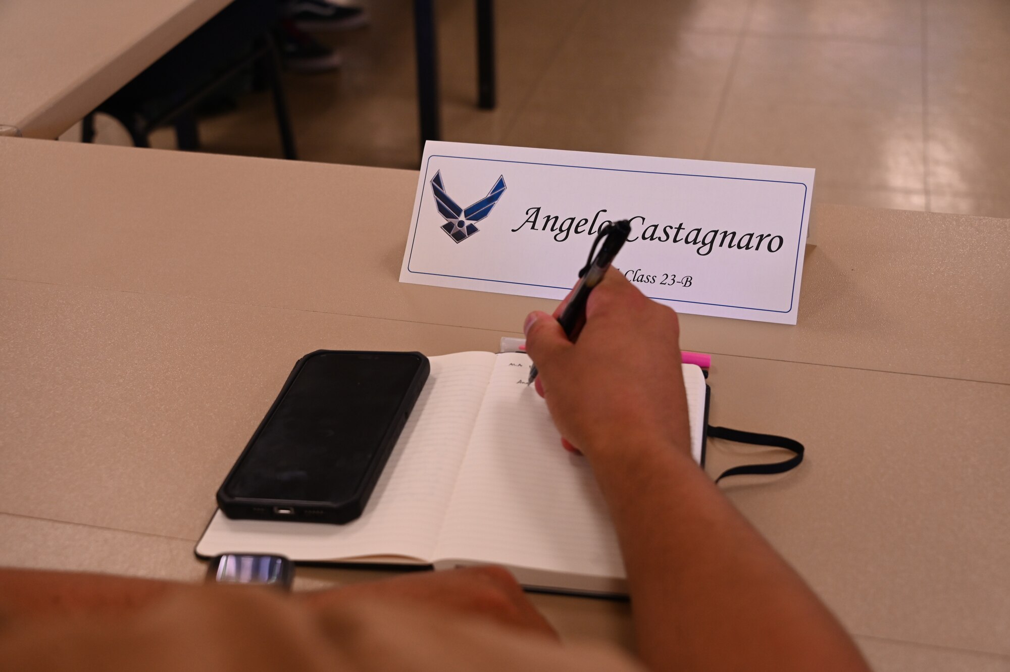 U.S. Air Force Staff Sgt. Angelo Castagnaro, 97th Civil Engineer Squadron pavements and equipment supervisor, takes notes during an Airman Leadership Academy class at Altus Air Force Base, Oklahoma, Sept. 18, 2023. At the end of the course, each student had to do a presentation based on an interview, or series of interviews, they conducted with senior noncommissioned officers from around the base. (U.S. Air Force photo by Airman 1st Class Kari Degraffenreed)