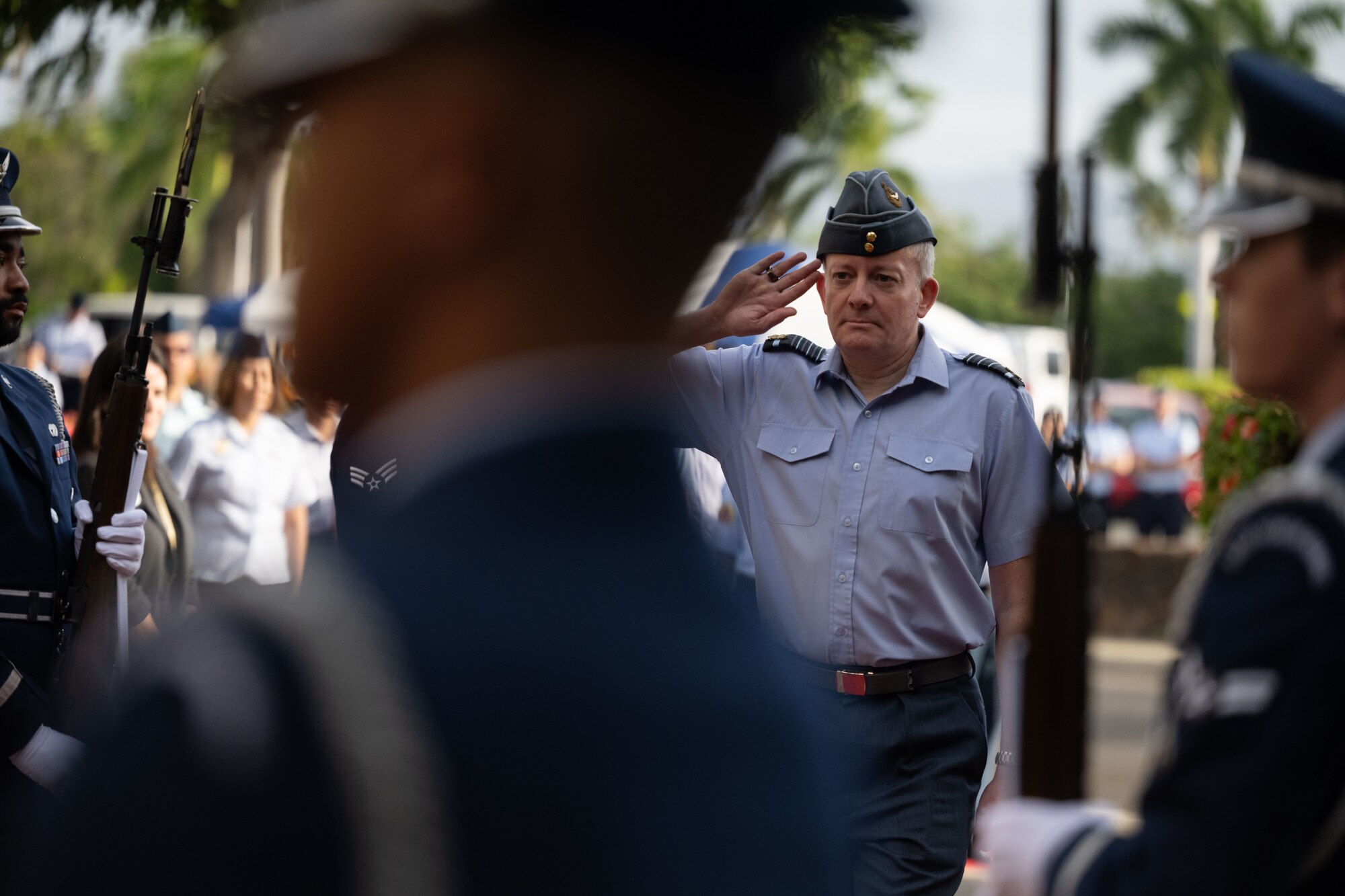 Royal Air Force Air Chief Marshall Richard Knighton, Chief of the Air Staff, salutes through the honor cordon during the opening ceremony of the Pacific Air Chiefs Symposium 2023 at Joint Base Pearl Harbor-Hickam, Hawaii, Nov. 14, 2023. The Pacific Air Chiefs Symposium brought together air chiefs and senior enlisted leaders from around the globe to address shared challenges and strengthen partnerships throughout the Indo-Pacific. This year’s symposium, the largest in history, focused on applying global lessons to the challenges of regional security. (U.S. Air Force photo by Tech. Sgt. Hailey Haux)