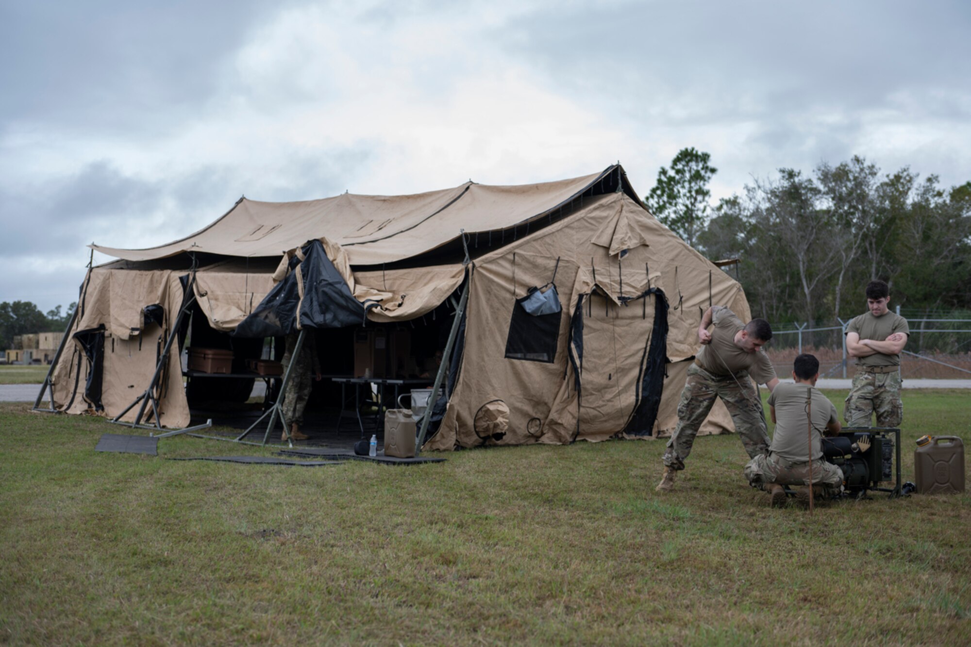 U.S. Air Force Airmen assigned to the 23rd Wing assemble a single pallet expeditionary kitchen during Mosaic Tiger 24-1 at Avon Park Air Force Range, Florida, Nov. 14, 2023. Airmen assigned to the 23rd Force Support Squadron are responsible for providing food, lodging and more during wing readiness exercises. (U.S. Air Force photo by Senior Airman Rachel Coates)