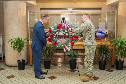 Naval Surface Warfare Center, Philadelphia Division (NSWCPD) Veterans Employee Resource Group (VERG) Champion Gary Saladino (left) and Planned Maintenance on Ships (PMS): Frigate Program, Program Manager’s Representative for the FFG 62 Land Based Engineering Site (LBES) Lt. Cmdr. Christopher Girouard conduct a wreath laying ceremony during the command’s annual Veterans Day and U.S. Marine Corps Birthday Observance on Nov. 8, 2023. (U.S. Navy Photo by Chief Petty Officer Chad M. Butler/Released)