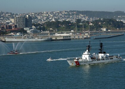 The Coast Guard Cutter Boutwell returns home to Alameda, Calif. to fanfare and water display from an Oakland and San Francisco fire boat.  Boutwell left Alameda on January 3 in support of U.S. operations in the Persian Gulf and the Iraqi War.