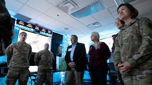 Chief Master Sgt. of the Air Force JoAnne Bass, second from left, shakes hands with Senior Airman Geoffrey Alvarado, autonomous drone operations specialist, 88th Communications Squadron, at a drone program brief during a visit to Wright-Patterson Air Force Base. During the base visit,  she toured the Air Force Research Laboratory’s 711th Human Performance Wing Nov. 9, 2023. (U.S. Air Force photo / Keith Lewis)
