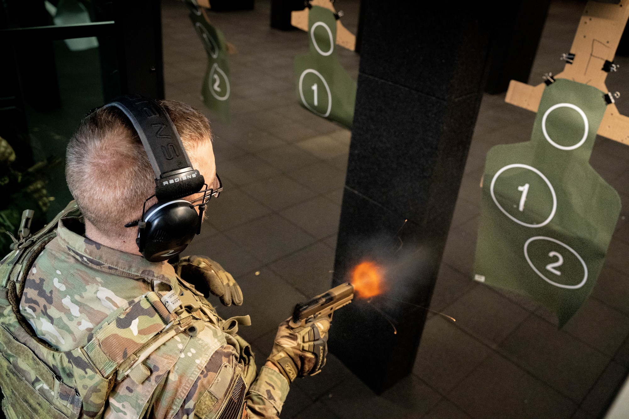 U.S. Air Force Staff Sgt. Vernon Gebers, defender with the 114th Security Forces Squadron, fires the M18 Modular Handgun System during the Defender Qualification Course (DQC) at Joe Foss Field, South Dakota, Nov. 4, 2023