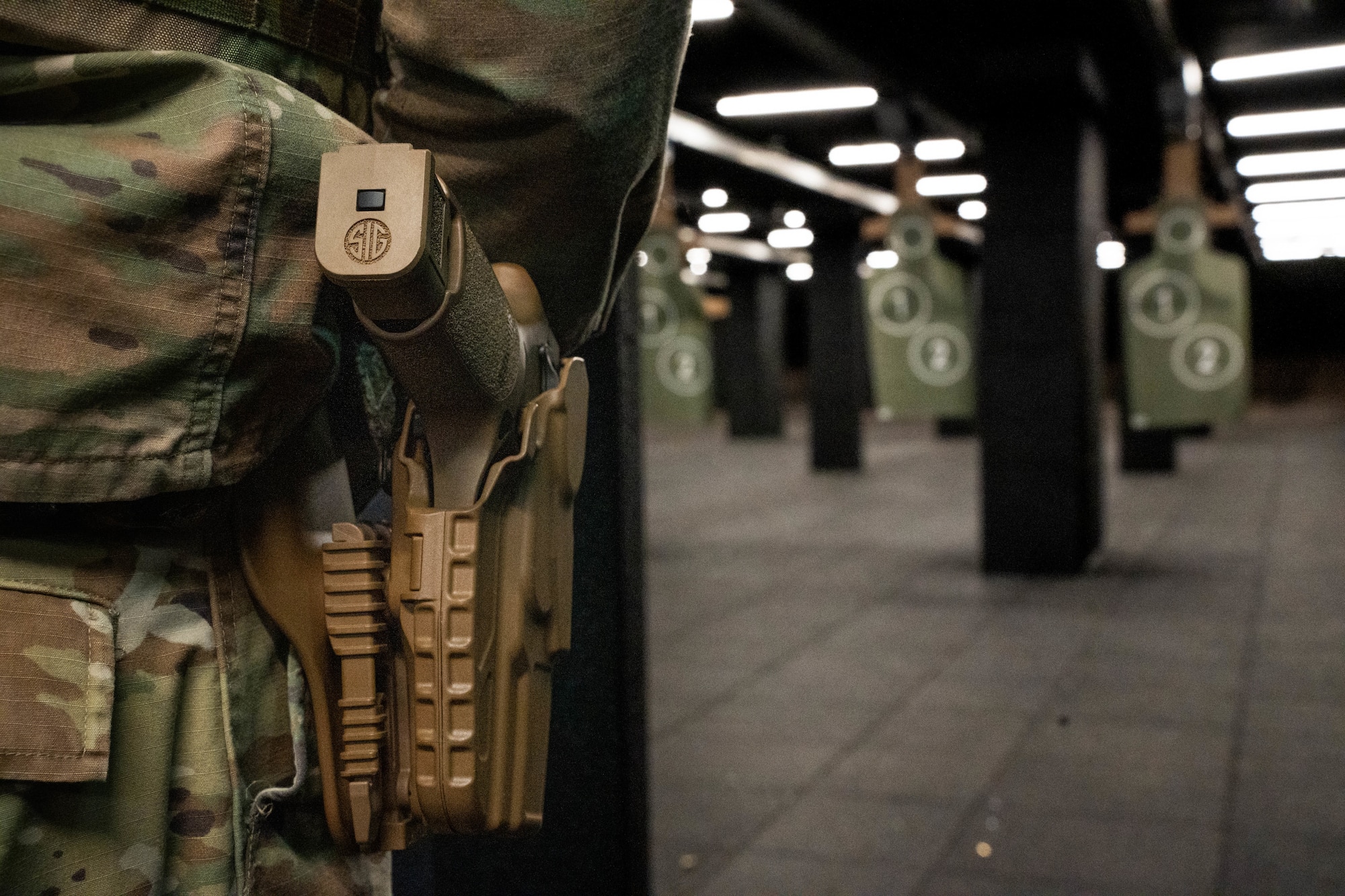 The 114th Security Forces Squadron defenders fire the M18 Modular Handgun System during the Defender Qualification Course (DQC) at Joe Foss Field, South Dakota, Nov. 4, 2023.