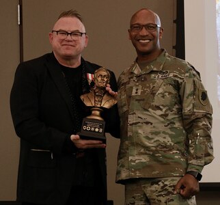 Maj. Gen. Rodney Boyd (right), the Assistant Adjutant General - Army of the Illinois National Guard and Commander of the Illinois Army National Guard, presents Brig. Gen. (ret.) Chris Lawson with a Lincoln bust in appreciation for his speaking at the Illinois Army National Guard Commander's Guidance Seminar.