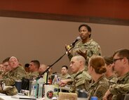 1st Lt. Gabrielle Cole of Chicago asks a question during a town hall at the Illinois Army National Guard Commander's Guidance Seminar.