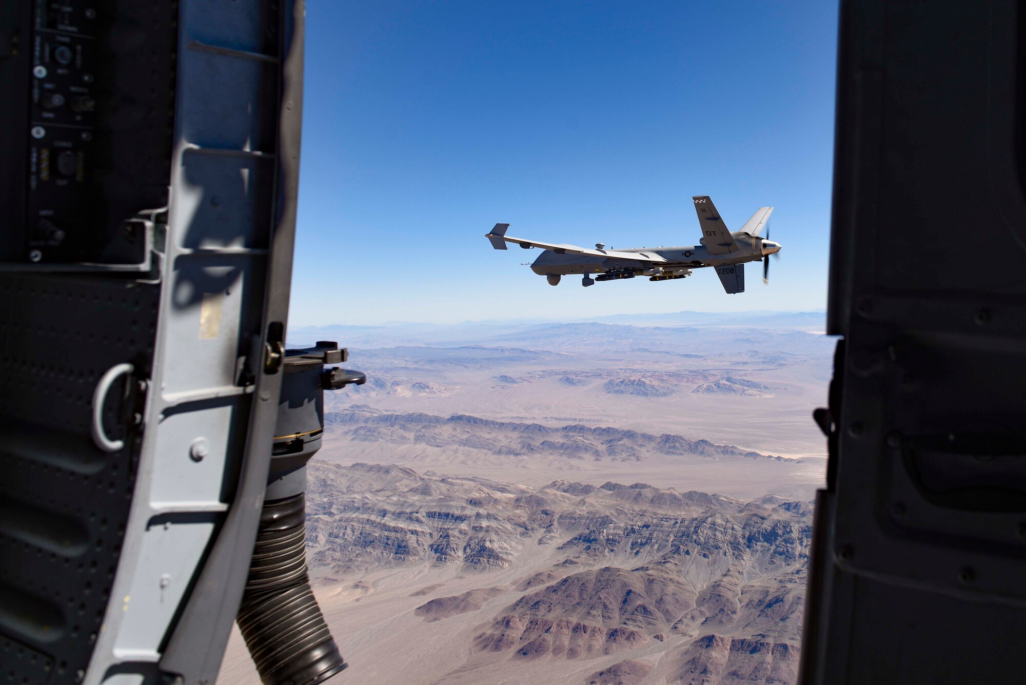 An MQ-9 Reaper fires a Hellfire Missile.