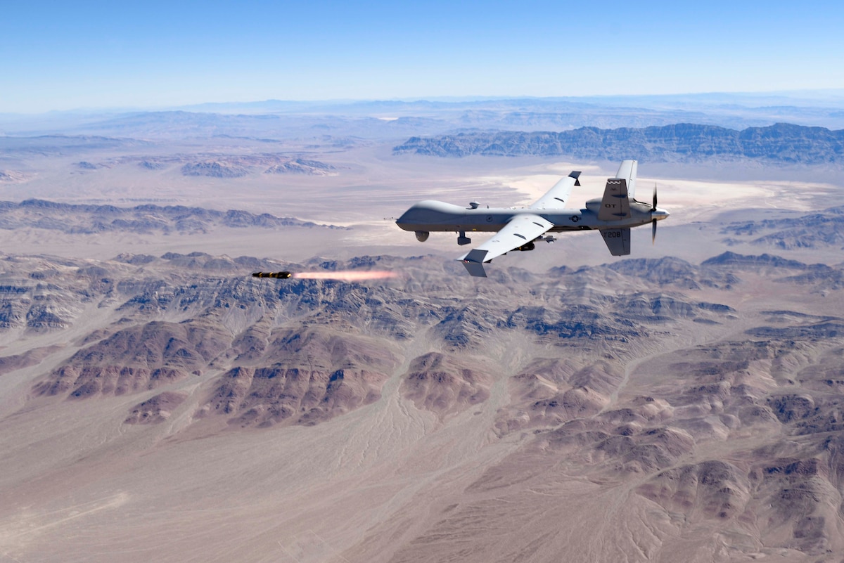 An MQ-9 Reaper fires a Hellfire Missile.