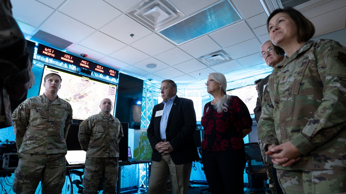 Chief Master Sgt. of the Air Force JoAnne Bass, right, stands with other distinguished visitors during a drone program brief during a visit to Wright-Patterson Air Force Base Nov. 9, 2023. During her visit, Bass toured the Air Force Research Laboratory’s 711th Human Performance Wing . (U.S. Air Force photo / Keith Lewis)