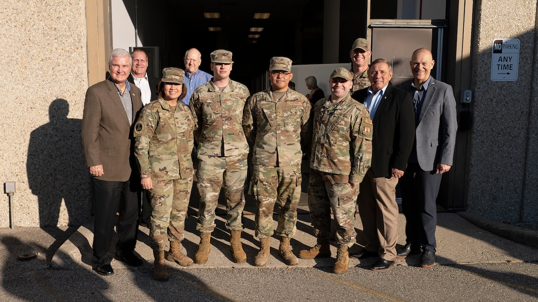 Chief Master Sgt. of the Air Force JoAnne Bass, second from left, stands with Airmen and other distinguished visitors following a drone program brief during a visit to Wright-Patterson Air Force Base Nov. 9, 2023. During her visit, Bass toured the Air Force Research Laboratory’s 711th Human Performance Wing. (U.S. Air Force photo / Keith Lewis)