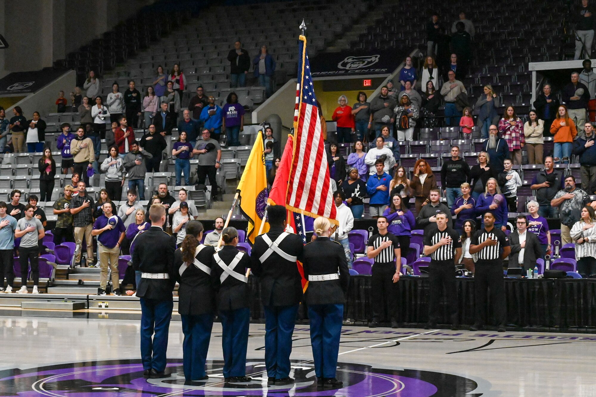 ROTC members hold flags and present the colors.
