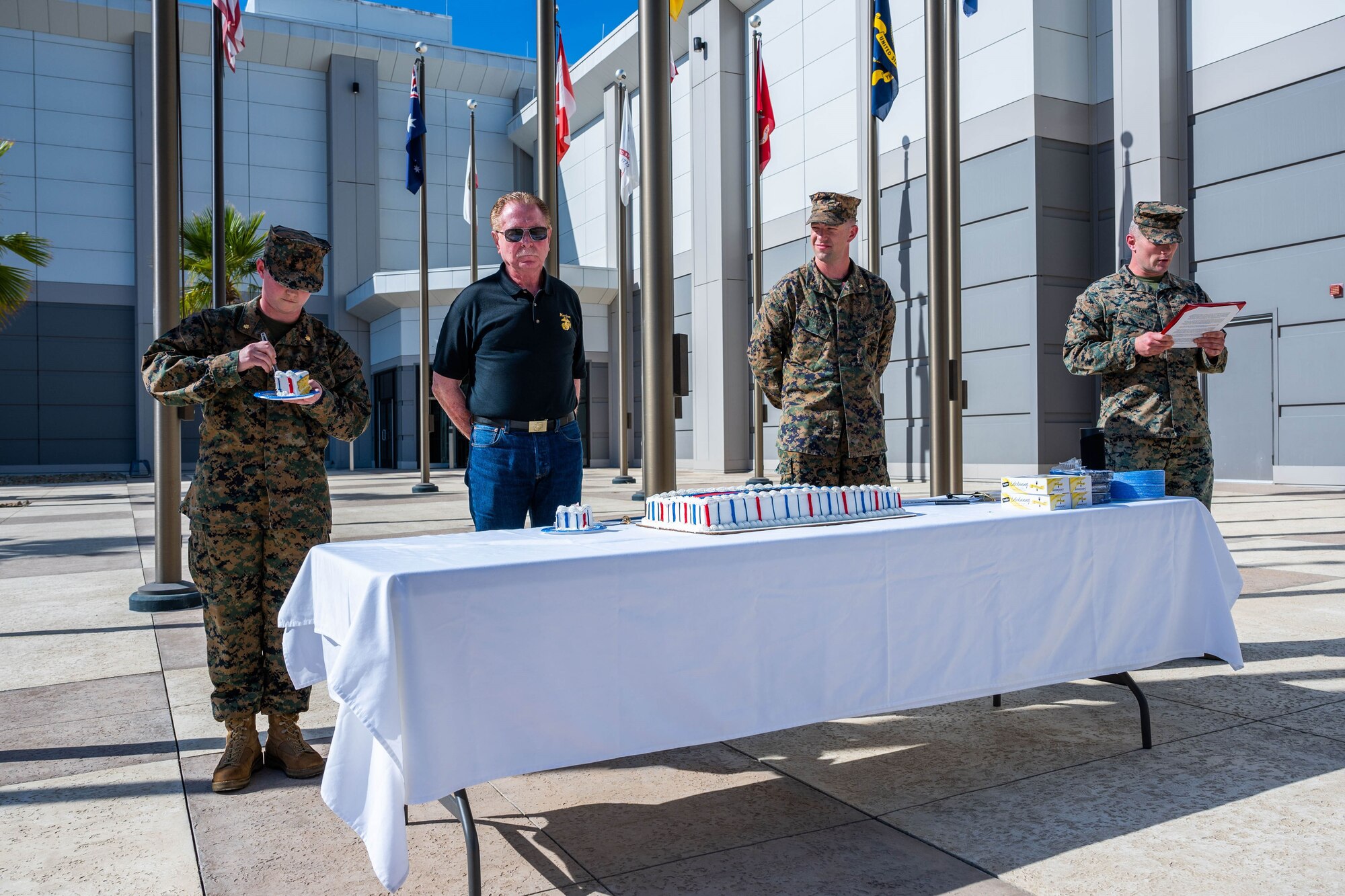 U.S. Marines and other members of the Combined Force Space Component Command celebrate the 248th birthday of the U.S. Marine Corps at the CFSCC Headquarters on Vandenberg Space Force Base, Calif., Nov. 9, 2023. CFSCC celebrated the birthday with reading of the Commandant's Birthday Message and a cake-cutting ceremony with the traditional passing from the oldest to youngest Marine present. (U.S. Space Force photo by Tech. Sgt. Luke Kitterman)