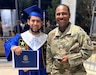 After the 2023 Sulphur High School graduation ceremony, SSG Joseph Smith proudly poses with a Future Soldier successfully recruited by him through the Army’s Lafayette, LA Recruiting Company—Lake Charles, LA Recruiting Station.  (Photo Credit: U.S. Army Recruiting Battalion-Baton Rouge Public Affairs)
