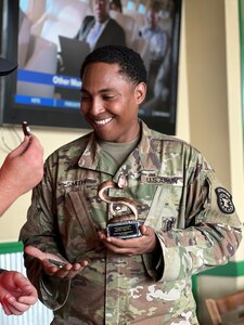 U.S. Army Soldier receiving award and Army coin