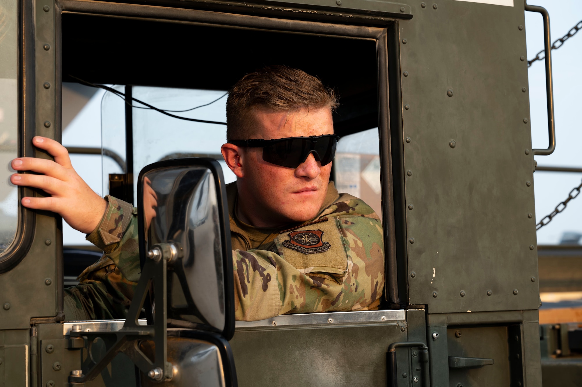 An Airman operates a K-Loader in preparation for a cargo offload.