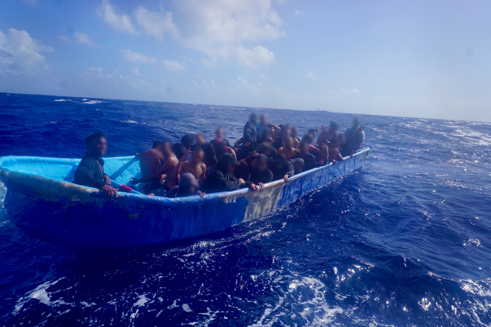 An unlawful irregular migration voyage vessel is interdicted by the Coast Guard Cutter Joseph Napier in Mona Passage waters west of Puerto Rico, Nov. 12, 2023.  Cutter Joseph Napier’s crew repatriated 34 migrants from this voyage to Punta Cana, Dominican Republic, Nov. 13, 2023. (U.S. Coast Guard photo)