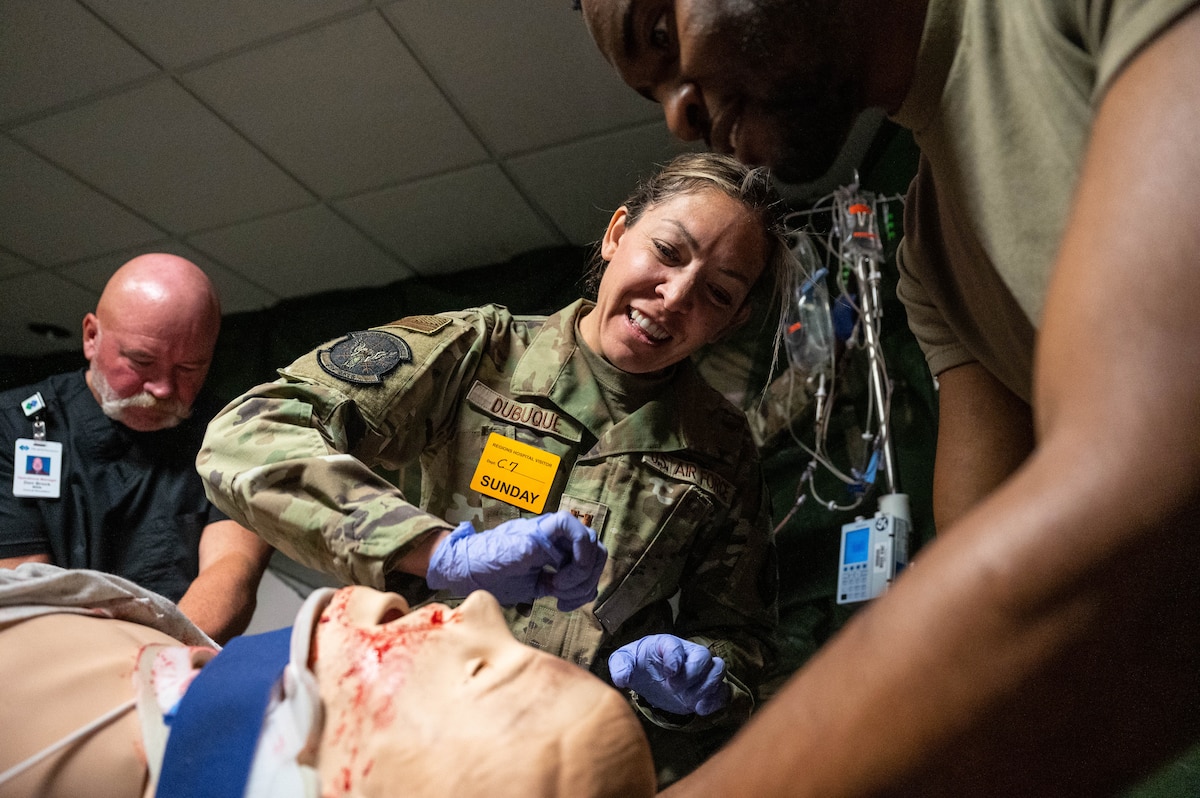 Captain Traci Dubuqe, an aeromedical technician from the 934th Aeromedical Staging Squadron, treats a dummy during a training exercise October 15, 2023 at Regions Hospital in St. Paul, Minnesota. Dubque was in charge of leading more junior airmen as they worked together to conduct the exercise. (U.S. Air Force photo by Senior Airman Victoriya Tarakanova)