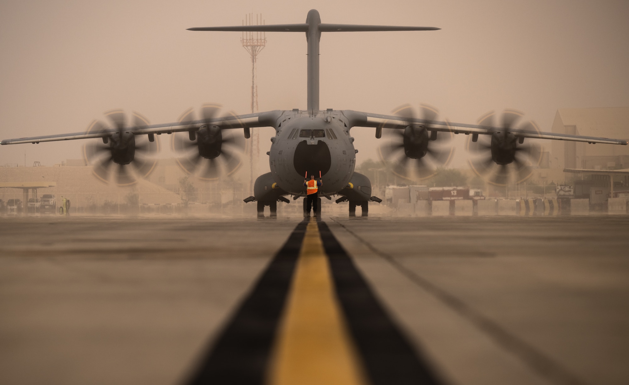 A U.S. Air Force Airman marshals in a RAF A400 Atlas.