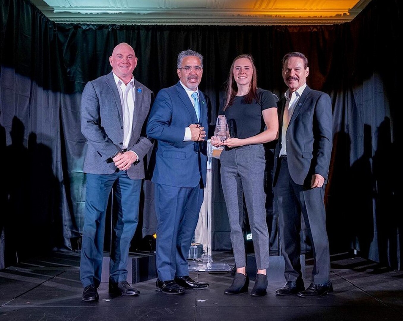 Nevada Air Guard Tech. Sgt. Hannah Kasner, second from right, receives the College of Southern Nevada’s Synergy Award from CSN President Fererico Zaragoza, second from left, in October 2023 in Las Vegas. Kasner was recognized for her work linking the college and Fiji National University through the Department of Defense National Guard Bureau State Partnership Program.