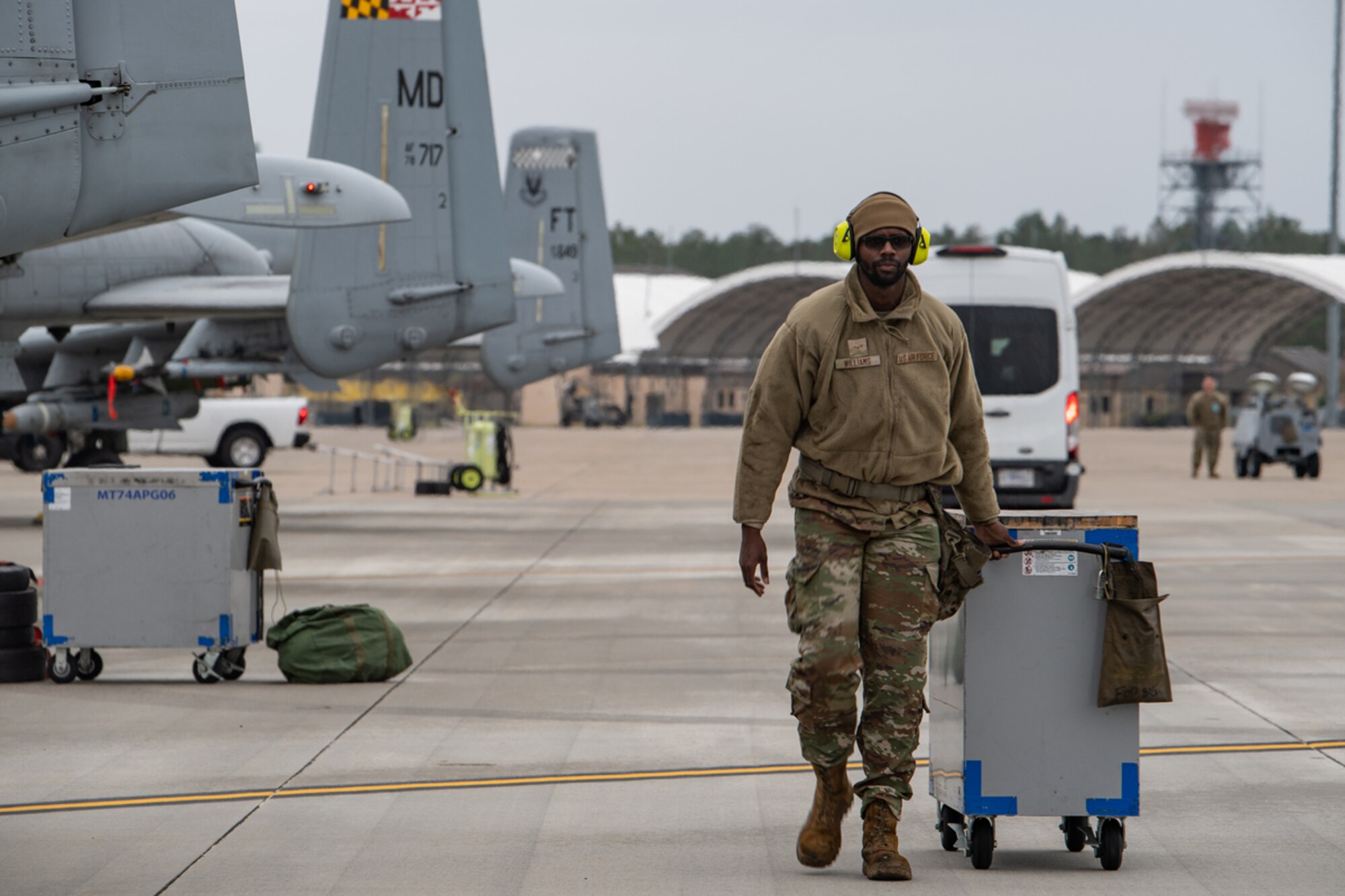U.S. Air Force Airman 1st Class Eriq Williams, 74th Fighter Generation Squadron weapons load crew member, walks his tool box down the flightline during exercise Mosaic Tiger 24-1 at Moody Air Force Base, Georgia, Nov. 14, 2023. The exercise was designed to test the 23rd Wing’s capability to rapidly deploy and conduct combat operations in an austere environment. (U.S. Air Force photo by Andrea Jenkins)