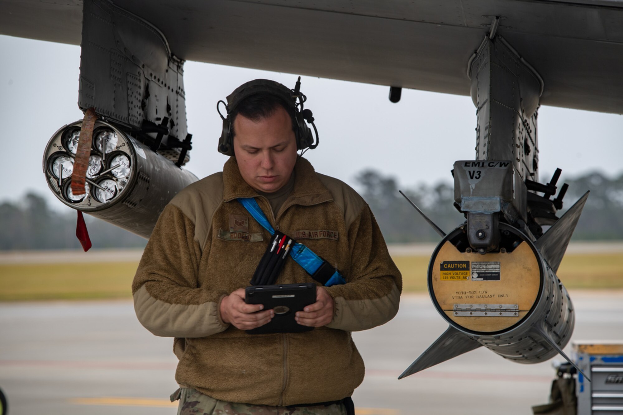 U.S. Air Force Staff Sgt. Concepcion Rodelo, 74th Fighter Generation Squadron weapons load crew member, checks technical order data during exercise Mosaic Tiger 24-1 at Moody Air Force Base, Georgia, Nov. 14, 2023. Members of the 23rd Wing Inspection Team were injecting scenarios into the exercise to evaluate the procedures and effectiveness of base operations. (U.S. Air Force photo by Andrea Jenkins)