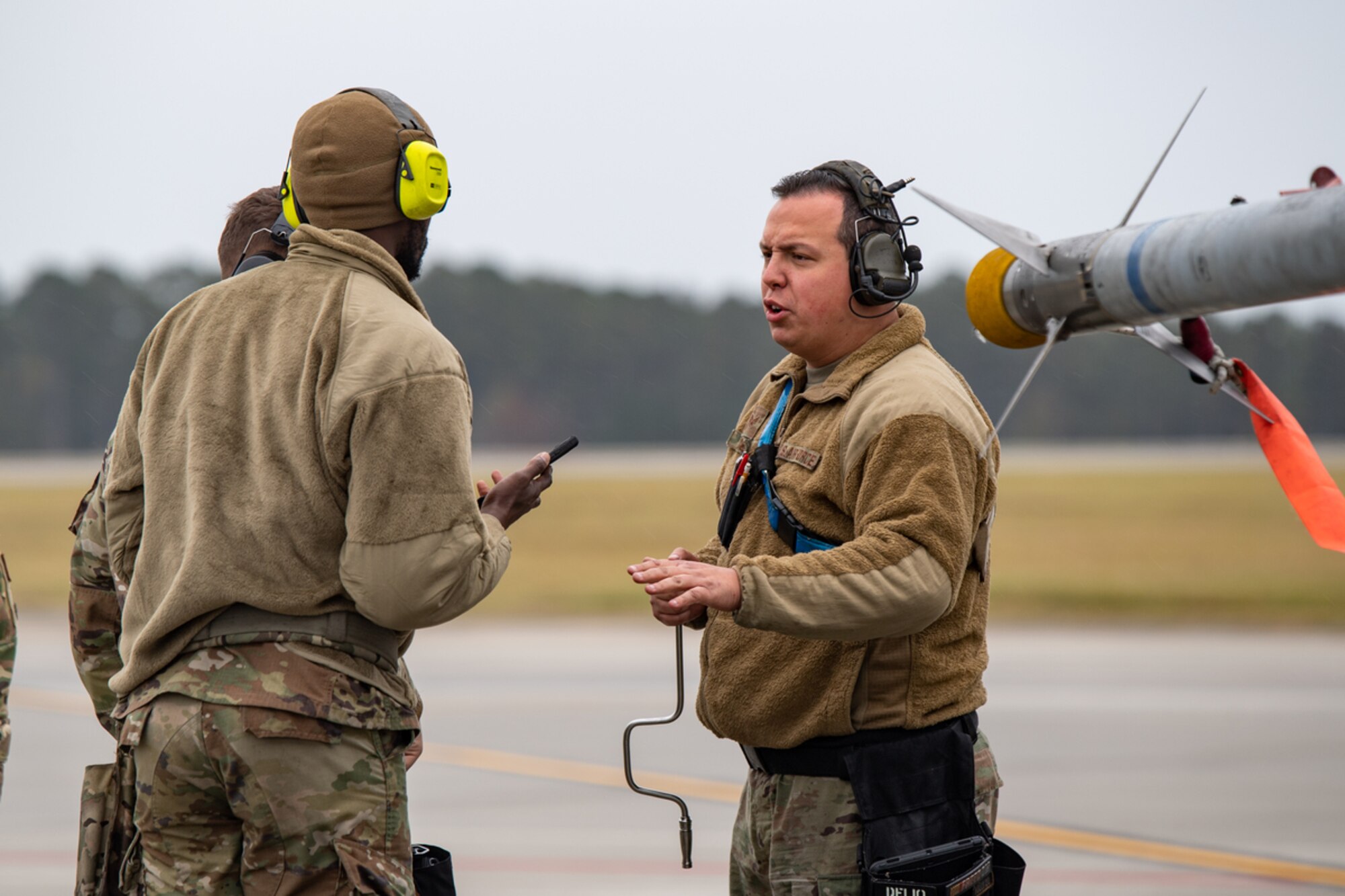 U.S. Air Force Staff Sgt. Concepcion Rodelo, 74th Fighter Generation Squadron weapons load crew member, alerts his team of a simulated dropped munition during exercise Mosaic Tiger 24-1 at Moody Air Force Base, Georgia, Nov. 14, 2023. The scenario injects were designed to mimic real-world emergency events to allow inspectors a chance to evaluate reactions of affected Airmen. (U.S. Air Force photo by Andrea Jenkins)