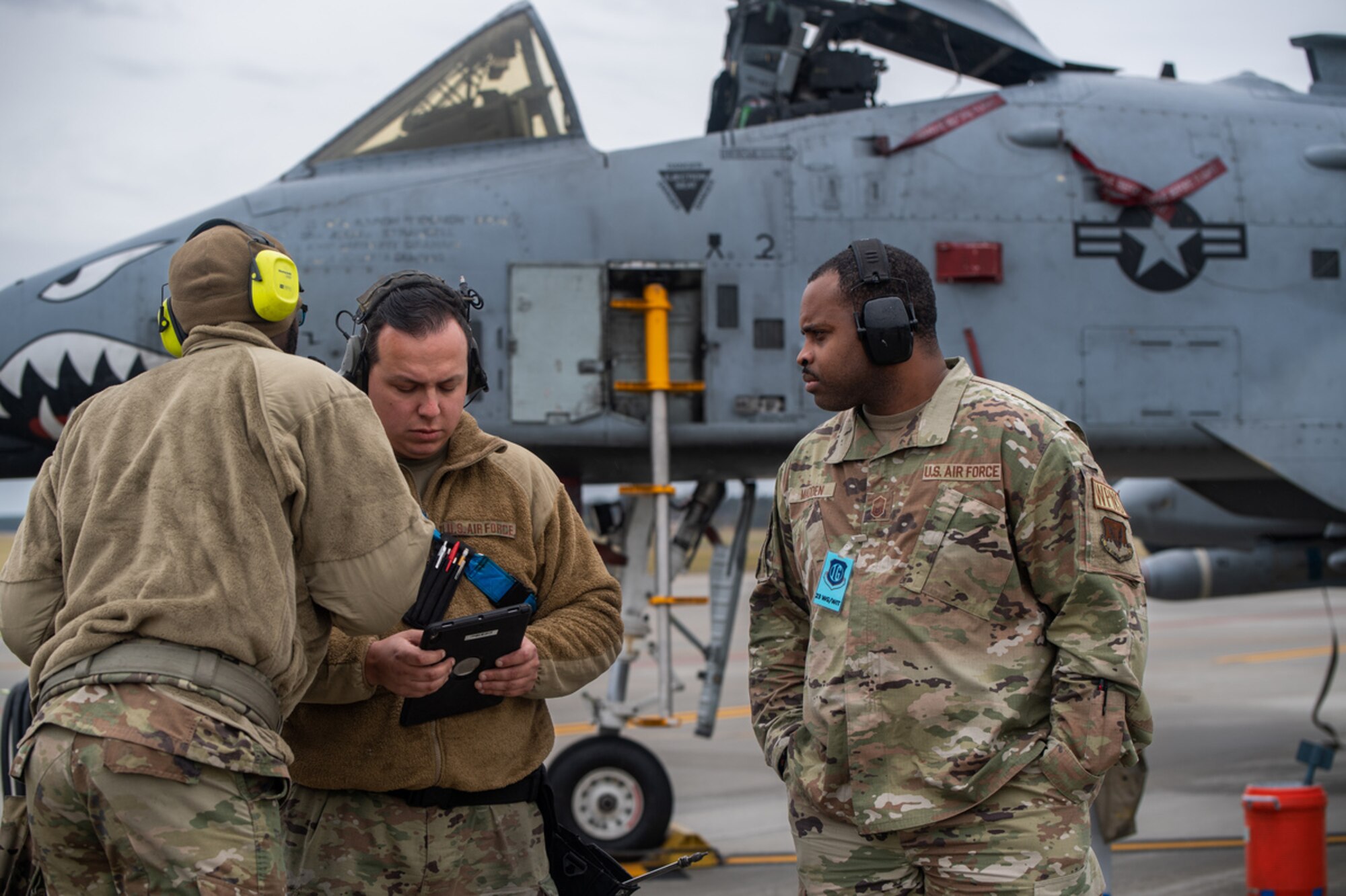 U.S. Air Force Senior Master Sgt. Jacoby Madden, 23rd Wing Inspection Team member, observes the actions of members of a weapons load team during exercise Mosaic Tiger 24-1 at Moody Air Force Base, Georgia, Nov. 14, 2023. The evaluators are experienced members of the activities they inspect to help course correct and provide a report to the wing commander on the effectiveness of wing operations. (U.S. Air Force photo by Andrea Jenkins)