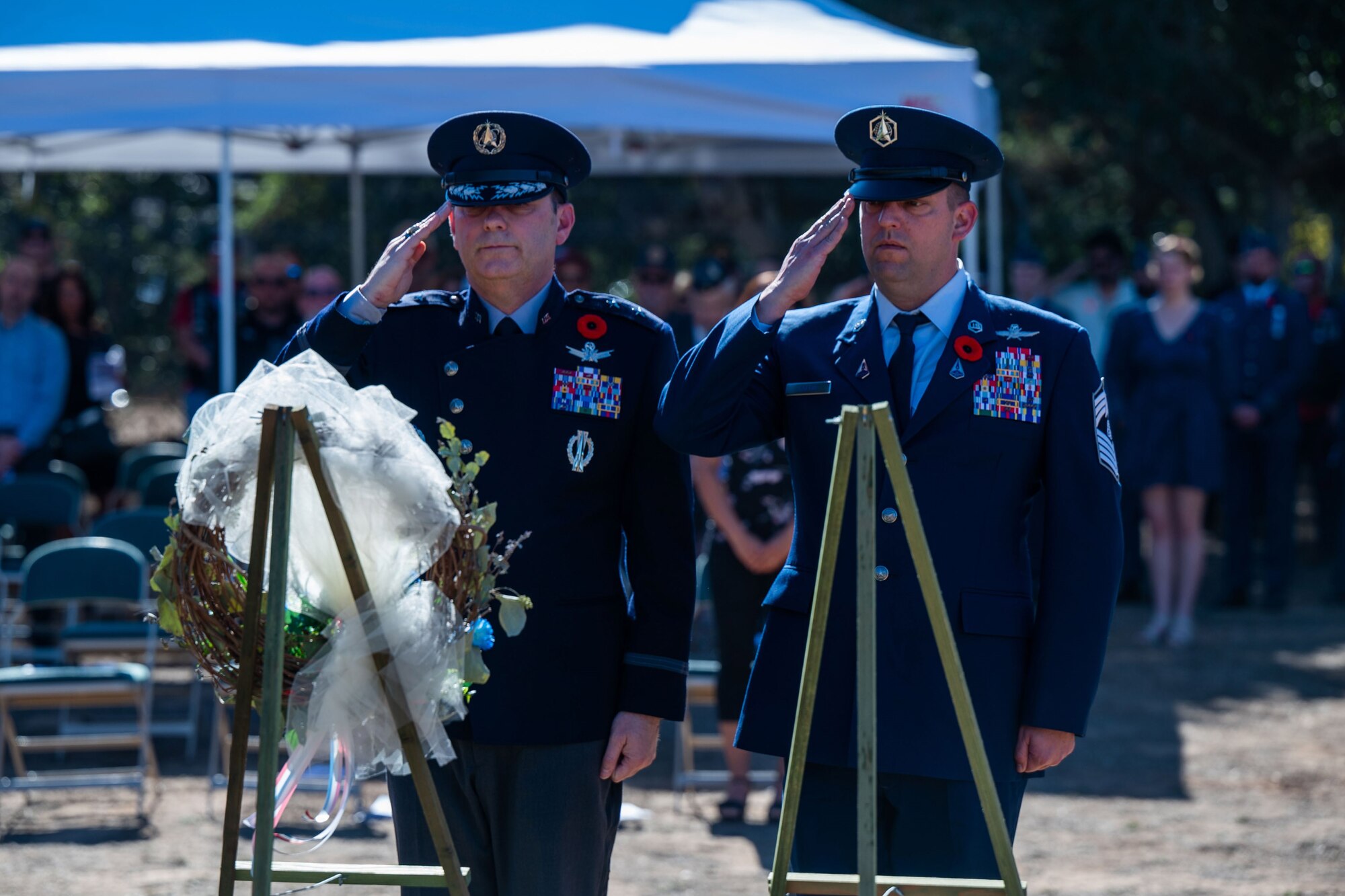 U.S. Space Force Maj. Gen. Douglas A. Schiess, Combined Force Space Component Command commander, left, and U.S. Space Force Chief Master Sgt. Grange S. Coffin, CFSCC senior enlisted leader, salute after laying a wreath during a Remembrance Day ceremony at Pine Grove Cemetery in Orcutt, Calif., Nov. 11, 2023. Combined Force Space Component Command members from the U.S., U.K., Australia, and Canada participated in the ceremony, held by the American Legion Post 534, which was a tribute to those who gave their lives in World War I, and to all the men and women who have served since. (U.S. Space Force photo by Tech. Sgt. Luke Kitterman)