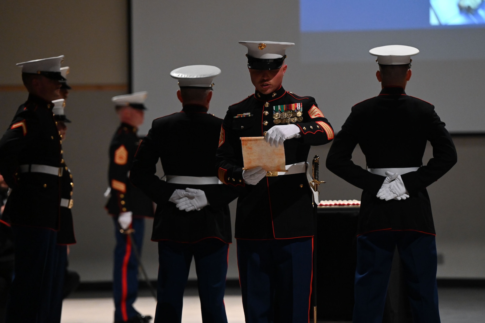 U.S. Marine Corps Staff Sgt. Norman Ross, 312th Training Squadron fire instructor, reads Gen. John A. Lejeune’s birthday message during the 248th Marine Corps Birthday Ball at the McNease Convention Center, San Angelo, Texas, Nov. 10, 2023. Marine Corps units hold birthday celebrations every year to reflect on the traditions, history and legacy of the Marine Corps. (U.S. Air Force Evelyn J. D’Errico)