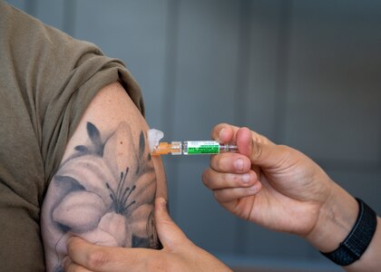 A patient is vaccinated with the influenza vaccine on Nov. 14, 2023, at Wilford Hall Ambulatory Surgical Center, Joint Base San Antonio-Lackland, Texas. Active duty can walk-in to receive their influenza vaccine in the WHASC atrium between the C and D wings. (U.S. Air Force photo by Senior Airman Melody Bordeaux)