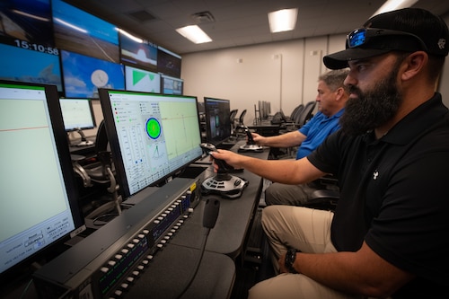 Remote control operators, simulate command and control of a high-speed maritime target vessel.
