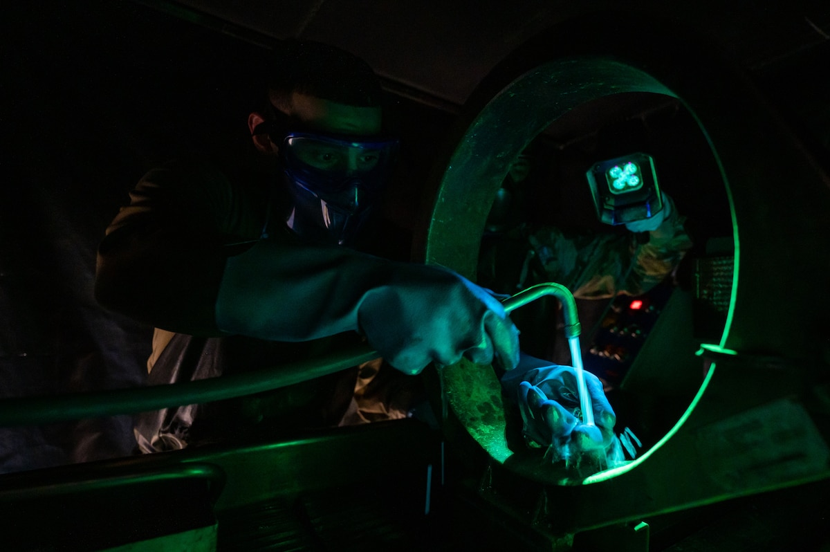 Senior Airman Mario Gomez magnetizes items during an inspection.