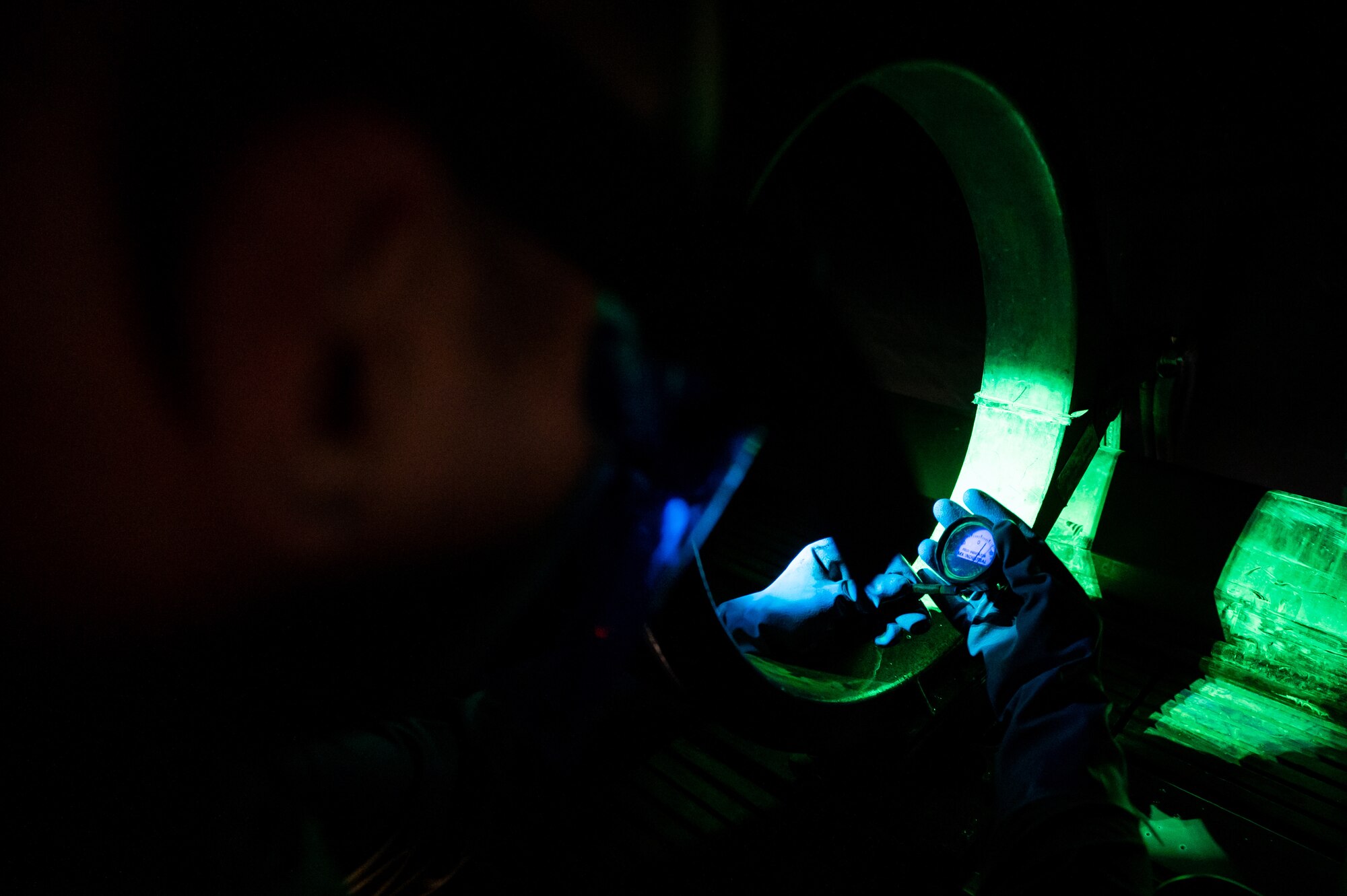 Senior Airman Mario Gomez measures the magnetization of an item during an inspection.