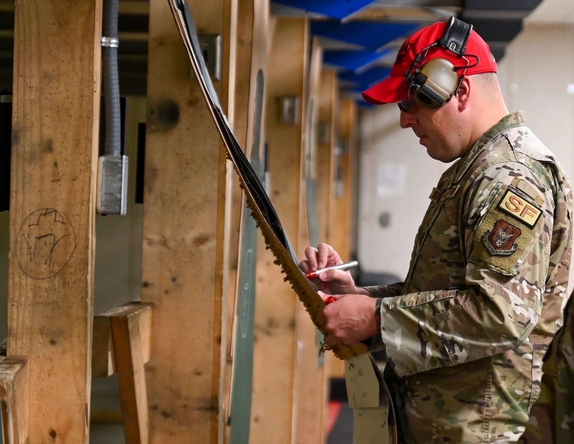 Master Sgt Christopher Winslow, the Combat Arms Training and Maintenance noncommissioned officer-in-charge, 442d Security Forces Squadron, oversees operations at the range November 3, 2023 at Whiteman AFB, Mo.